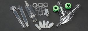 Transparent precision medical plastic parts, including tubes, connectors, and other components